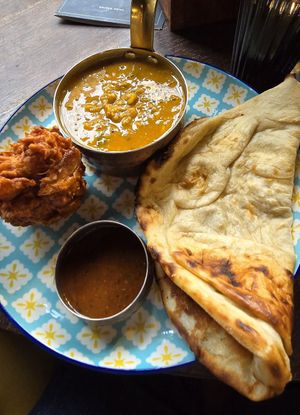Tadka dahl, plain naan, onion bhaji at Bombay Delicatessen in Nottingham