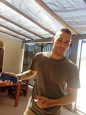 Waiter and co-owner at Big Leaf Mesa  in La Paz