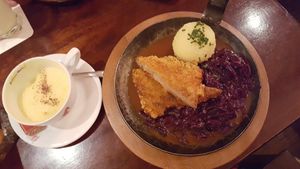 Golden milk, Pfanderl (soy steak, beer sauce, red cabbage, potato dumpling) at Bodhi in Munich