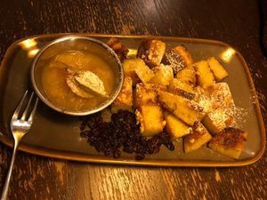 A sophisticated version of bread pudding where by it is cut into pieces and then baked with nuts and currants. at Bodhi in Munich