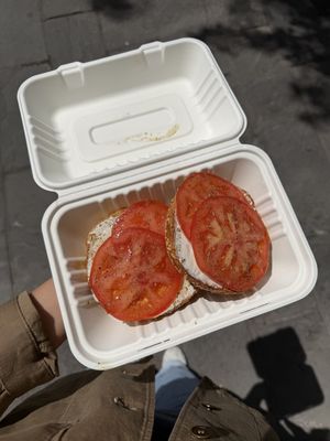 Sesame with vegan cream cheese and tomato  at Apollo Bagels in New York City
