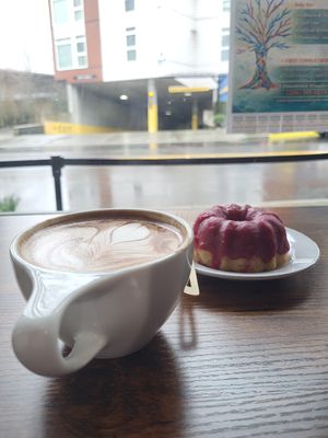 Orange mocha latte with berry bunt cake at Three Cats Coffee in Woodinville