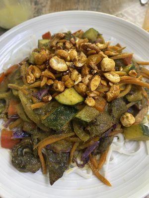 Green curry veggies over rice noodles   at Island Naturals Cafe in Seven Mile Beach