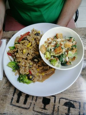 Rasta pasta with Caesar salad at Island Naturals Cafe in Seven Mile Beach