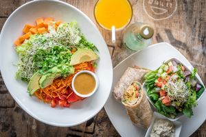 Big Chopped Salad, Falafel Burger Wrap and Fresh Juice at Island Naturals Cafe in Seven Mile Beach