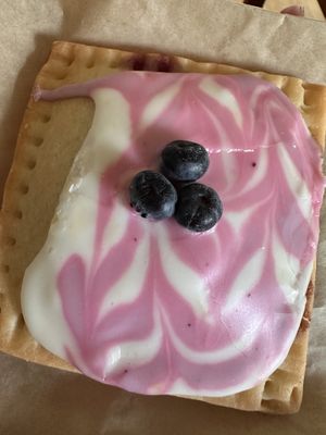 Blue berry poptart with frosting and topped with fresh blueberries   at Hold the Wheat in St Louis Park