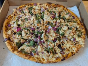 Plant based butter chicken pizza at Pizza Twist - N Euclid Ave in St Louis