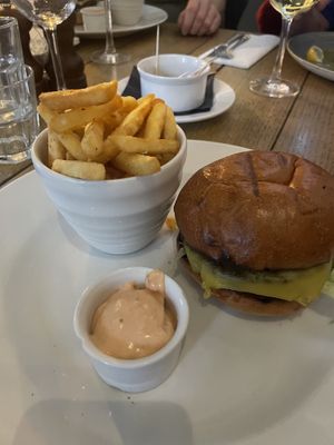 Symplicity plant-based cheeseburger, smokey pickles, signature sauce, fries  at The Havelock Tavern in West London