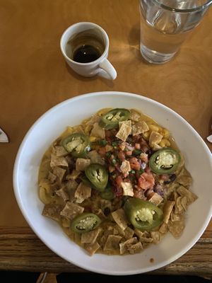 pickled jalapeños, tortilla chips, queso, macaroni, salsa, and vegan chili   at Handlebar in Chicago