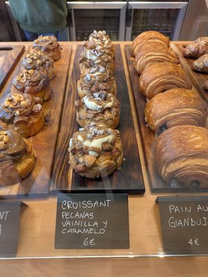 Croissant dough topped with nuts, caramel and vanilla at Magma Bakery Lab  in Barcelona