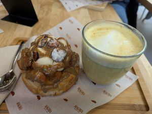Golden milk and croissant roll at Magma Bakery Lab  in Barcelona