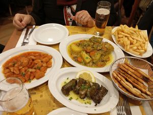 Artichokes, beans, stuffed grape leaves, fried potatoes at To Steki in Bologna