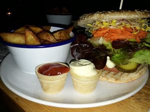 Chrissy Hyndes burger with wedges at Let It Be in Berlin