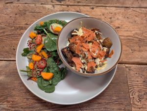 Baby roast potatoes with cheese & bacon bits and a side salad at Peas and Libertea in Whitley Bay
