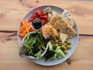 Mediterranean plate with homemade olive flatbread, homemade sesame-free houmous and antipasti at Peas and Libertea in Whitley Bay