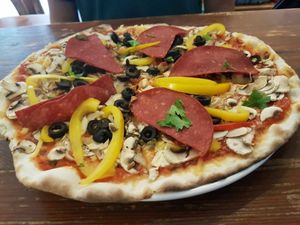 We chose the big pizza, without parmesan and mozzarella. We added vegan cheese, paprika, vegan salami, funghi, olives and chili. The pizza was very thin and soooo crispy, one of the best me and my friend had ever had. And she goes to Italy frequently so she should know!  at SlimJims in Hamburg