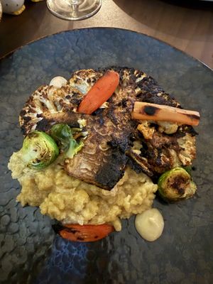 Cauliflower steak which came with a side of vegan roasted vegetables   at Sage  in Westport