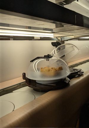 Tofu nigiri on the general band. at Kura Sushi - Nijo in Kyoto