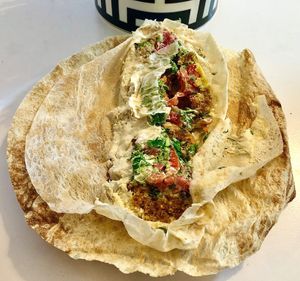 Hummus, falafel and green salad sandwich at Foul w Hummus in Dubai