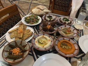 Falafel, kibbeh, dolmades, salad, hummus, baba ganoush, red pepper sauce, fried eggplant and pita bread.  at Beirut in Panama City