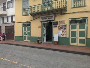 The sign to the right of the door says "vegetarian" on the very bottom left at La Cazuela in Cuenca