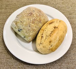 Olive roll and mini tomato baguette  at AOC in Dubai