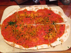 Flammkuchen - pumpkin, oregano and tomato sauce - vegan option - amazing! at TIAN Bistro Kunsthaus in Vienna