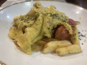 Huevos rotos con butifarraa  at Bar La Plazuela in Gran Canaria