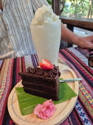 Chocolate cake with banana smoothie. at Baanrainaifun Organic Garden in Chiang Mai