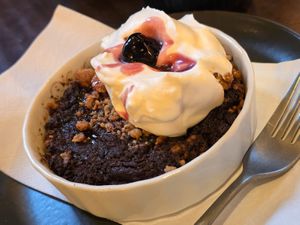 Baked chocolate tart with cream at Von Zehn bis Vier at Academy Bar in Salzburg