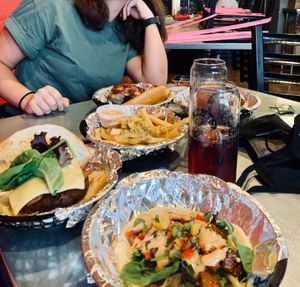 Delicious veggie burger with vegan cheese (far left), garlic fries with vegan aioli (middle), and the “Hulk” toco with seitan (front). at Yellow City Street Food - YCSF in Amarillo