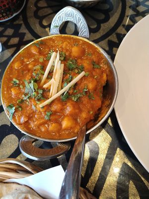 Chana Amritsari is vegan. Mild is delicious when supporting all spices in dish, medium hot was only hot( not given any higher value)- my opinion 😁. Ginger sticks on top the dish at Tandoori Night's Restaurant in Ao Nang