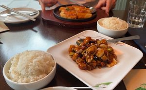 Peanut tofu and rice (and sizzling tofu at the back)   at Tofu Vegan - Gloucester Rd in South West London