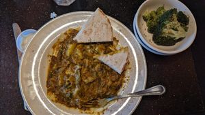 Oil-Free Biryani with a side of tahini and steamed broccoli at The Grape Leaf in Louisville