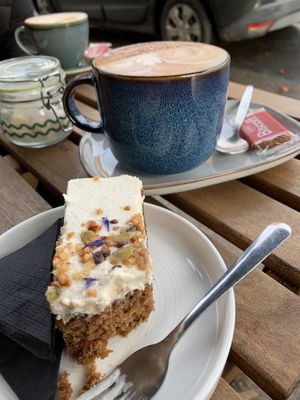 Carrot cake and an oat milk cappuccino   at Badger & Bean  in Howden