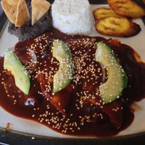 enmoladas with rice, plantains and beans  at Te Quiero Verde in San Cristobal De Las Casas