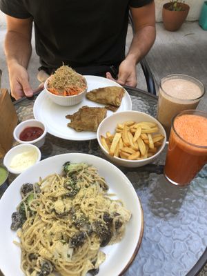 Vegan pasta Alfredo and a cordon bleue. Juices are with banana/peanuts/coconut milk, and carrot/apple/ginger  at Te Quiero Verde in San Cristobal De Las Casas