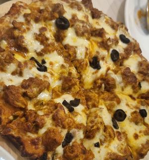 Curry chicken pizza at Gokul Raas Vegetarian - Little India in Central Singapore