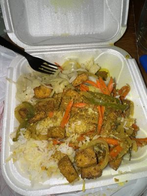 Curry tofu w/ white rice (I ate some before pic)   at Ionie's Carribbean Kitchen in Grayson