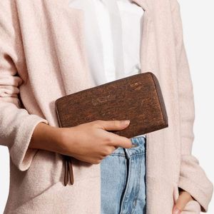 The Cork Wallet is a sleek zip-around vegan wallet cut from genuine cork. With a smart accordion interior, this piece will fit your phone, cash, coins and up to twelve cards. Just  at TERRATAVIDA - Pop-Up in Temple