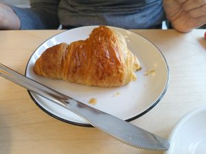 Half eaten croissant at Black Cat Santiago in Santiago De Compostela