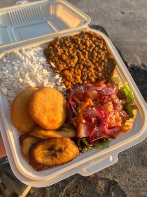 Lentil Curry with rice, plantains, arepitas, and salad. 

 at vegantamarindo in Tamarindo