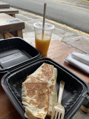 Burrito with orange juice  at Jet Fuel Coffee Shop in Jaco