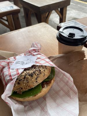 Bagel with americano  at Jet Fuel Coffee Shop in Jaco