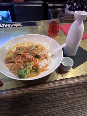 Panang curry with tofu and lychee sake  at Běndì Wok N' Bar in Columbus