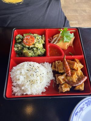 Vegan bento box (Sichuan cucumbers, jasmine rice, spring roll, fried tofu)   at Běndì Wok N' Bar in Columbus