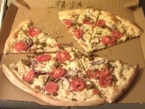 The same delicious Vegan White pizza, shifted to the other side of the box to show the oil that seeped through.  at Este Pizza - downtown SLC in Salt Lake City