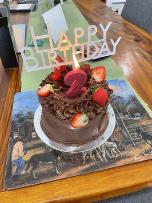 The cake in all her decorated glory- they can write on the cakes and do other tweaks to  cakes if requested😄  at Kynd Cakery in Sunshine Coast