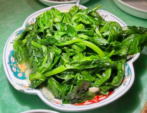 Sauteed Snow pea shoots at Café China - 傾國傾城 in New York City