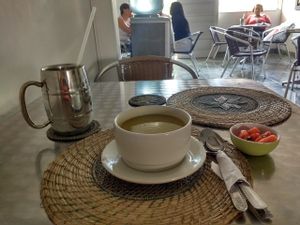 Vegetable soup, guava juice and a small dish of papaya and raisins. at Govinda's in Barranquilla